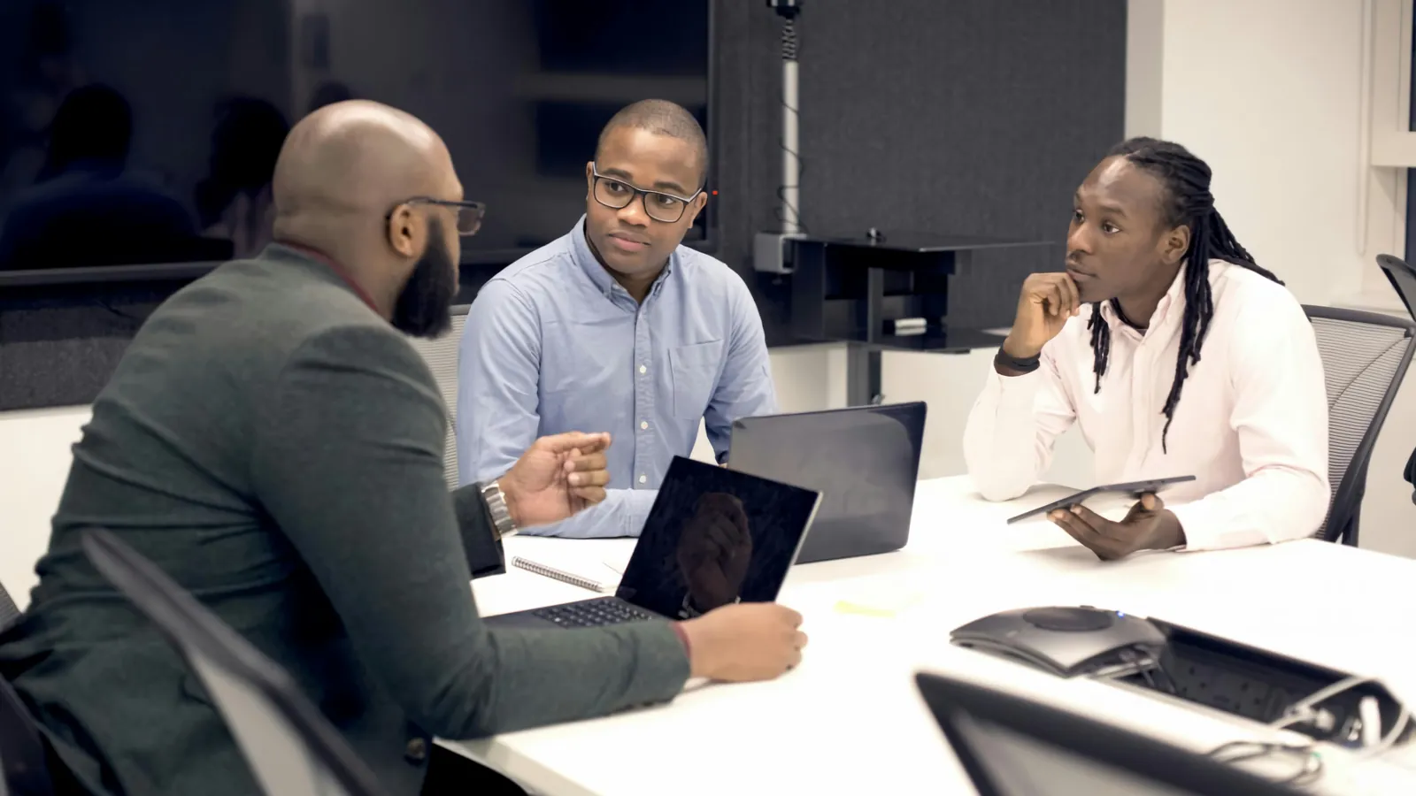 Founders presenting their business to a panel of investors